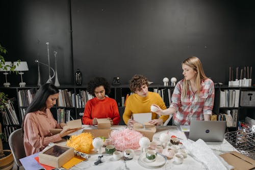 Free People Having a Discussion at Work Stock Photo