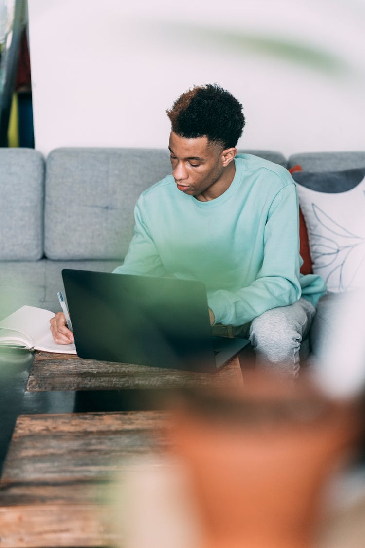 Serious Black Man Working At Home