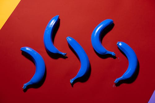 Blue Bananas on Red Surface