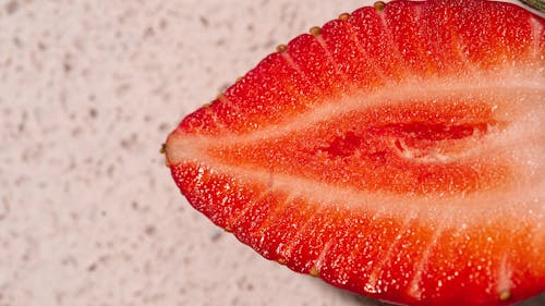 Close-Up Shot of a Slice of Strawberry