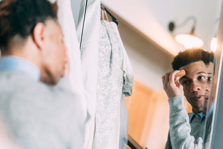 Black Man Looking At Mirror