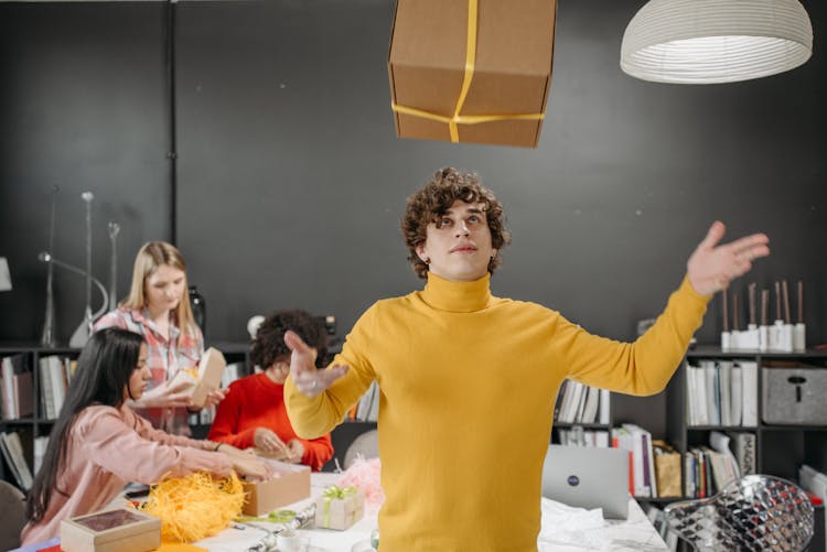 A Man Catching A Box