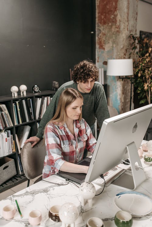 Free Businesspeople Working Inside an Office with a Computer Stock Photo