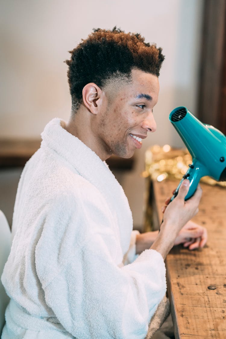 Man Using Blow Dryer