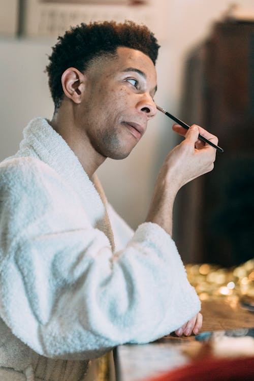 Man Using Make Up Brush 
