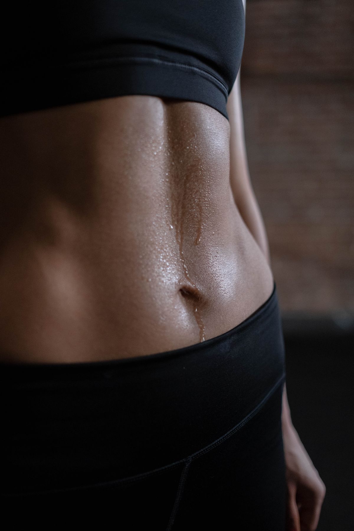 Close-up view of a person's toned core muscles