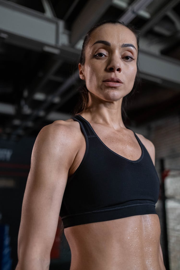 Woman In Black Sports Bra Sweating