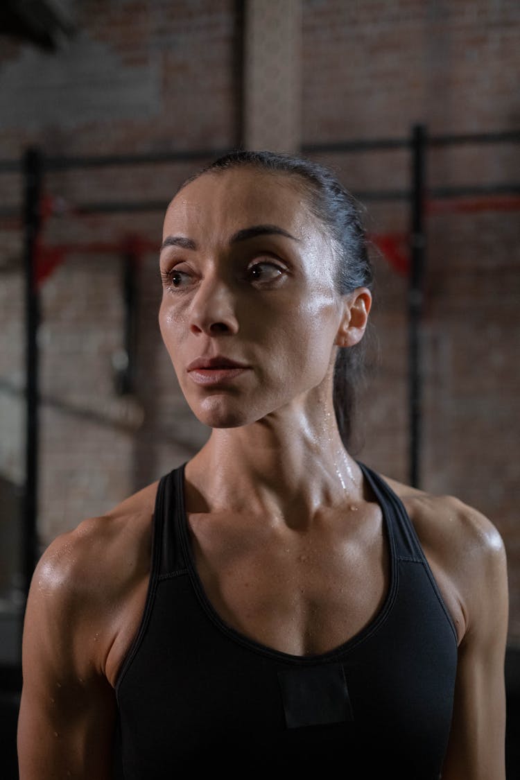 Woman In Black Sports Bra Sweating