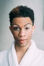 Serious black man with makeup