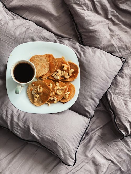 Free Pancakes in a Plate on Top of a Pillow Stock Photo