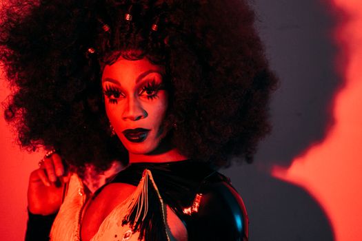 Extravagant ethnic transgender in wig