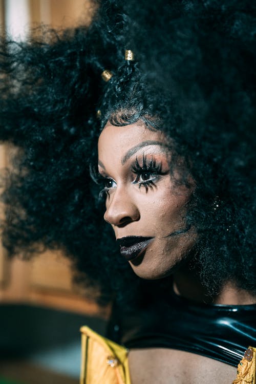Face of black crossdresser in makeup · Free Stock Photo