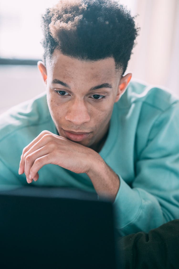 Black Man Looking At Laptop Screen