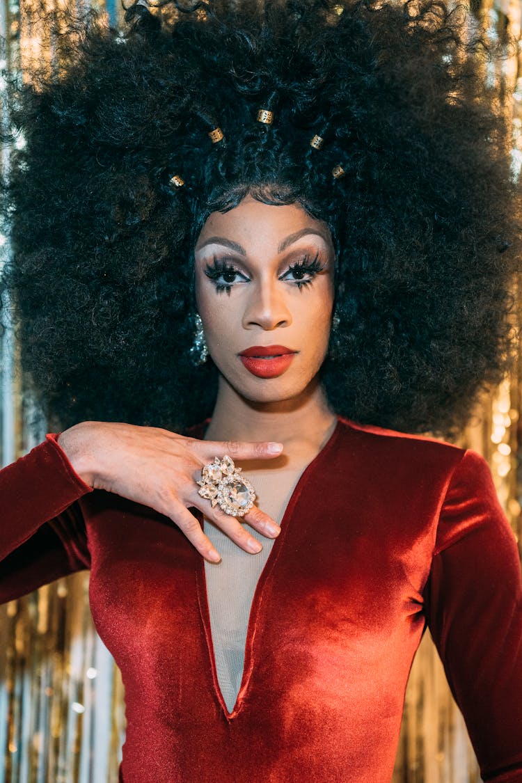 Ethnic Transgender Man In Red Dress And Afro Wig