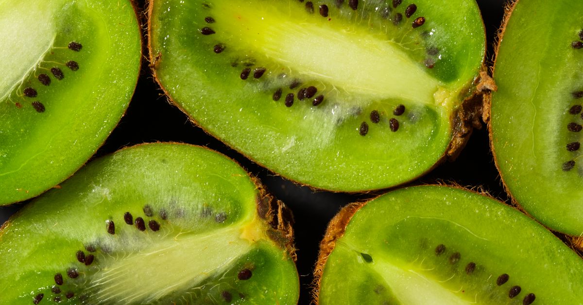 A detailed close-up of juicy kiwi slices showcasing fresh texture and seeds. - Evidence evidence guide for kiwi constipation randomized trial