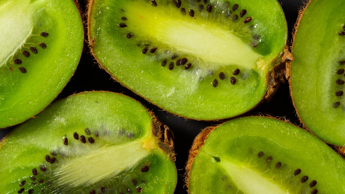Close-Up Photo of Kiwis with Black Seeds