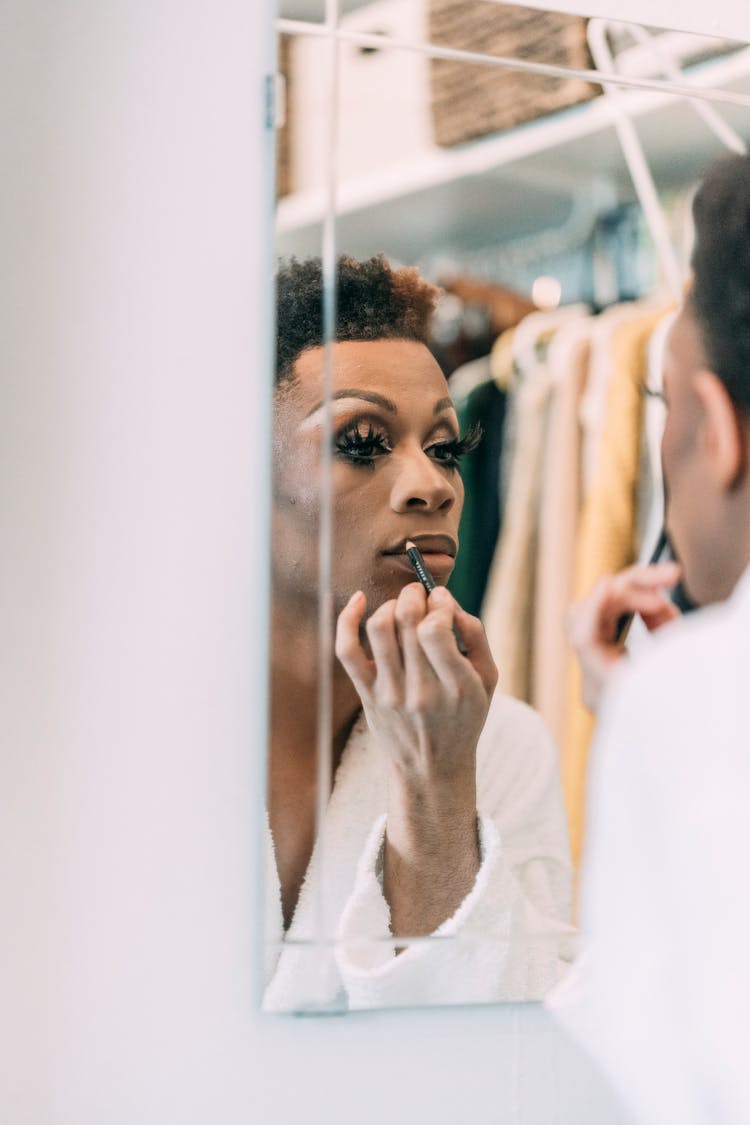 Black Man Doing Makeup Of Lip