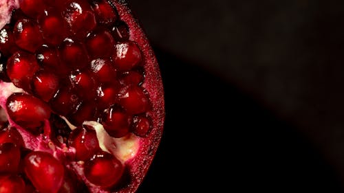 Close-Up Photo of a Pomegranate with Red Seeds