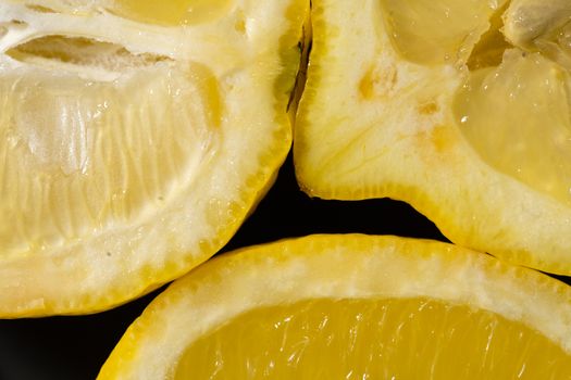 Close-up view of fresh lemon slices showing vibrant yellow pulp and juicy texture.