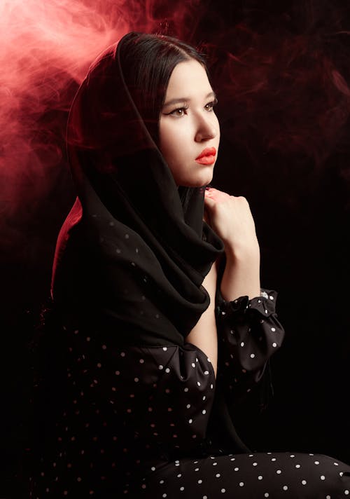 Woman in Black Hijab and Polka Dot Dress