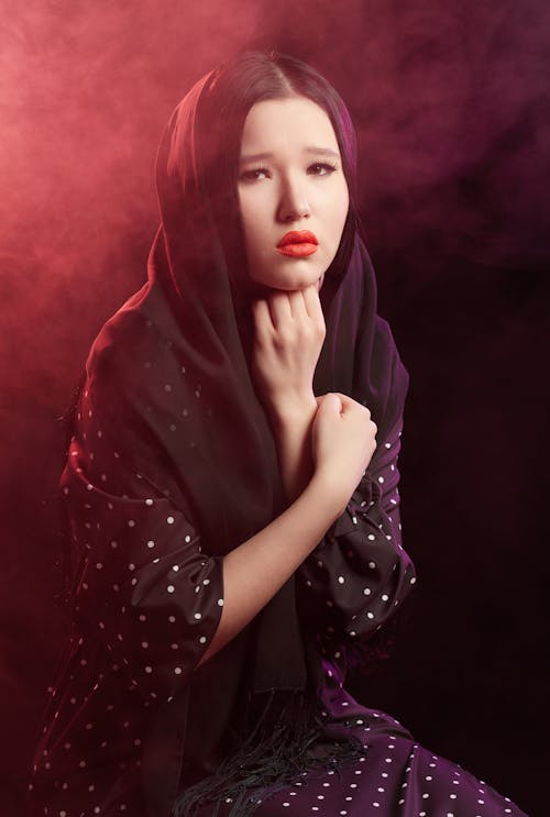 Free A Sad Woman Wearing Black Headscarf  Stock Photo