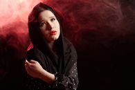 Woman in Black Hijab With Red Hair