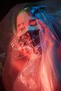 A Woman Suffocating in Plastic