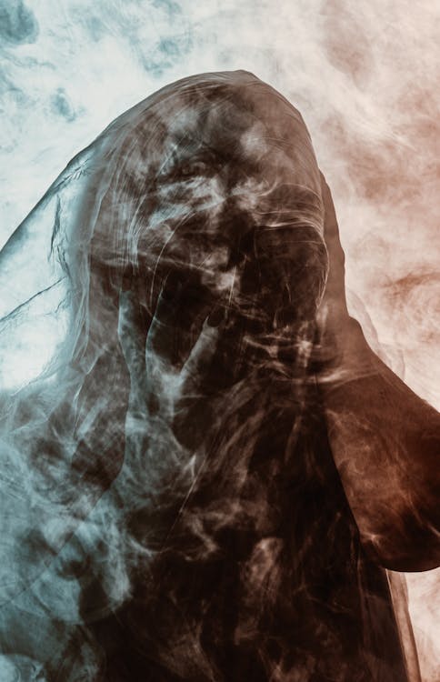 Free A Vague Picture of a Person Surrounded with Smoke Stock Photo