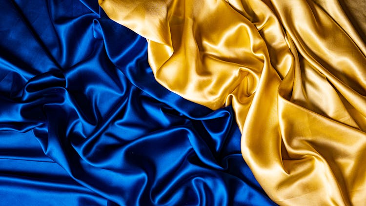 Close-up Smooth Silk Fabric In Blue And Yellow Colors 