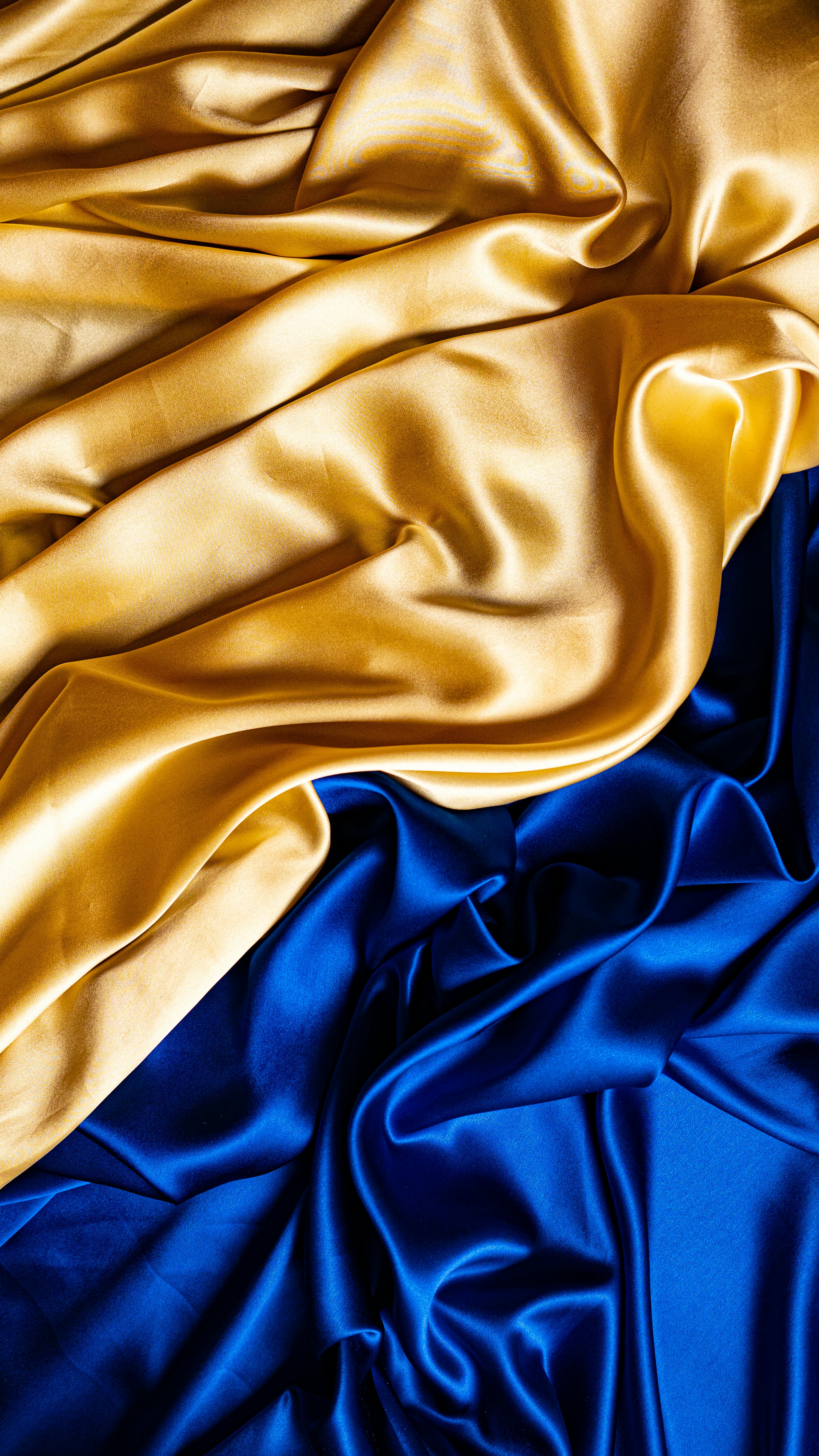 a blue and gold fabric in close up