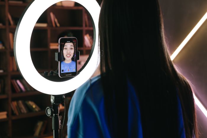 Creator recording social content with a ring light