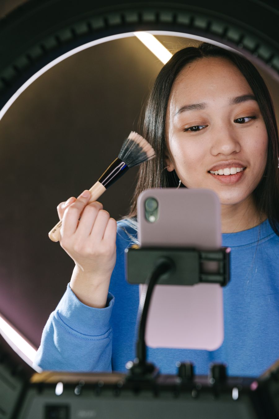 Creator filming with ring light
