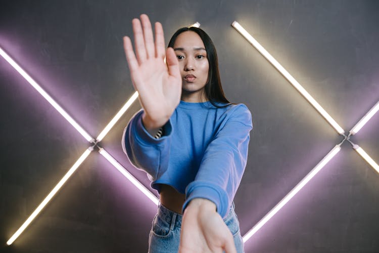 A Woman In Blue Sweater Dancing