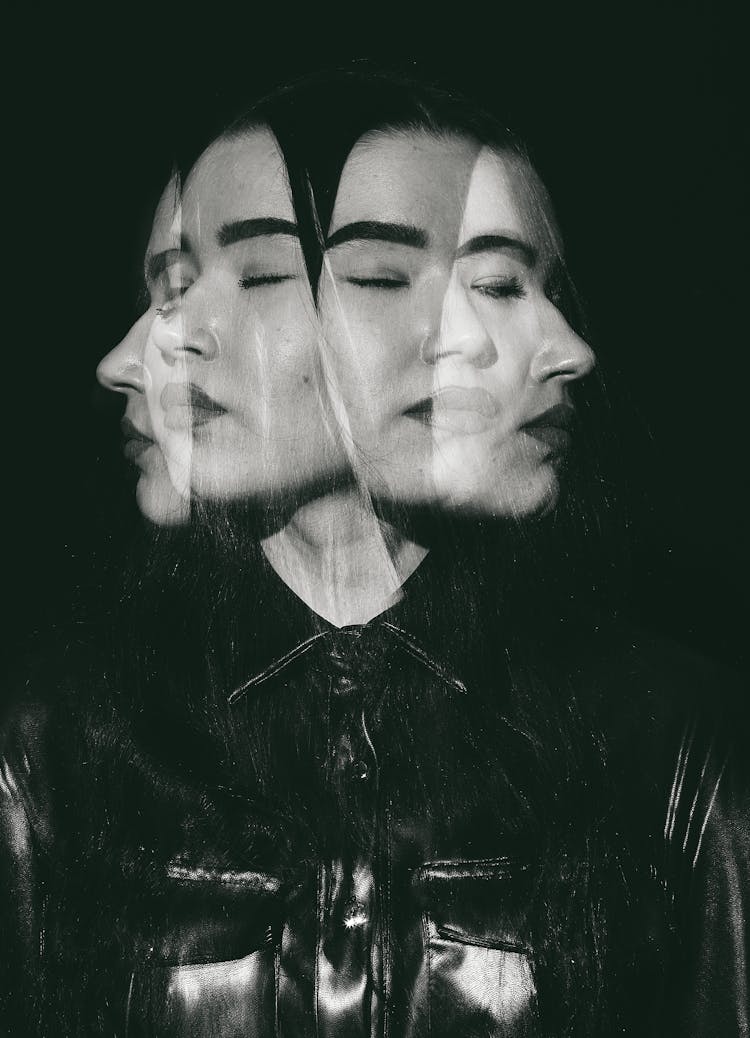 A Multiple Exposure Photography Of A Woman In Black Leather Top