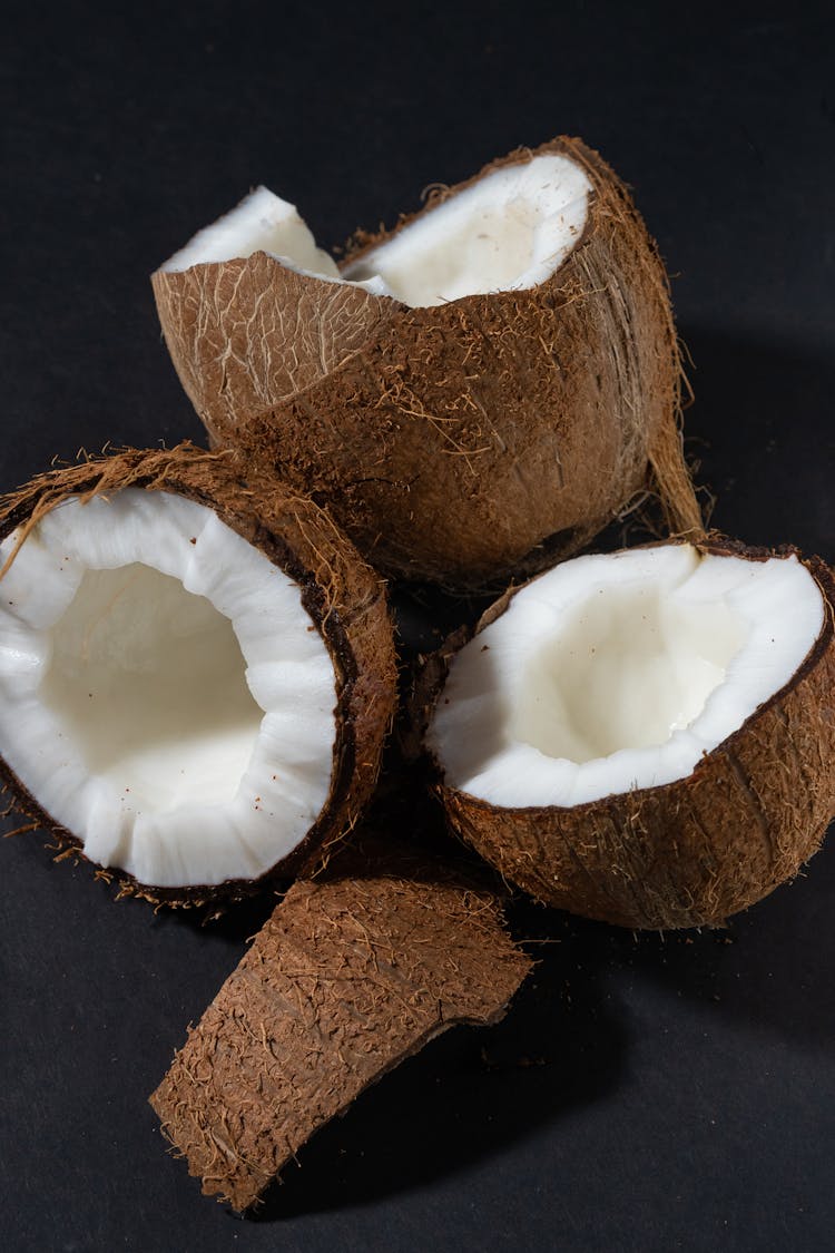 Close-Up Photo Of Coconuts With White Flesh