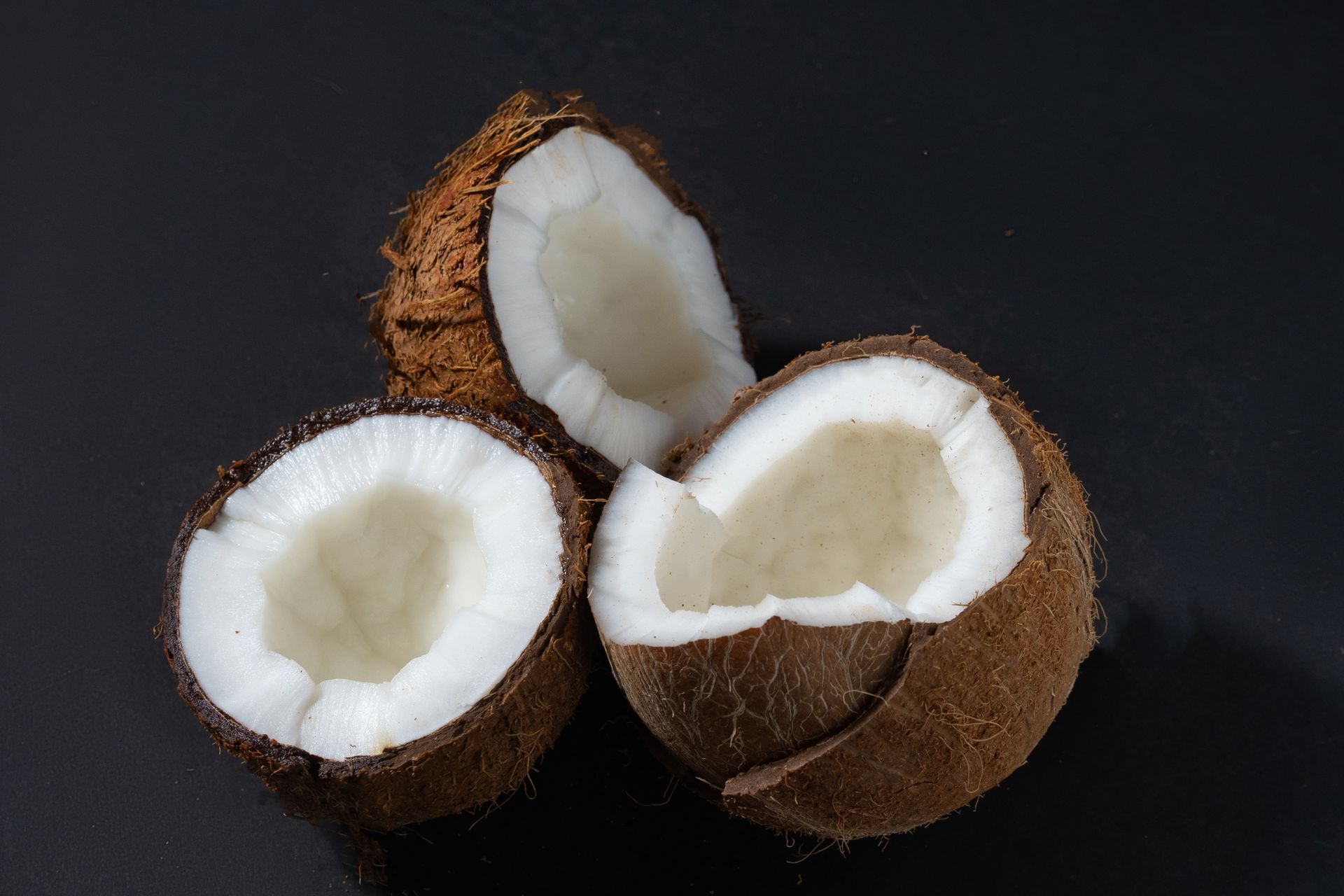 Close-Up Photo of Cracked Coconuts