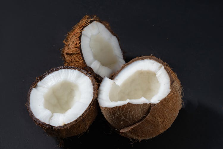 Close-Up Photo Of Cracked Coconuts