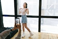 A Woman being Recorded with a Smartphone