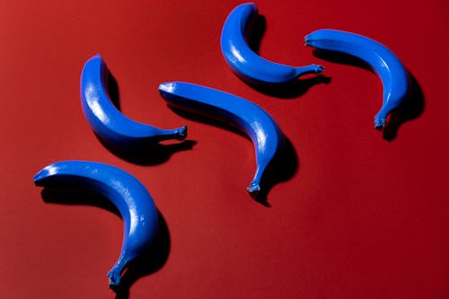 Blue Bananas on Red Background 