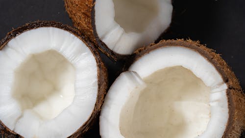 Close Up Photo of Opened Coconut Fruits 