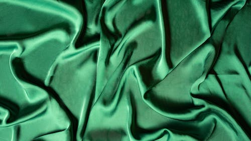 Green Textile on Flat Surface