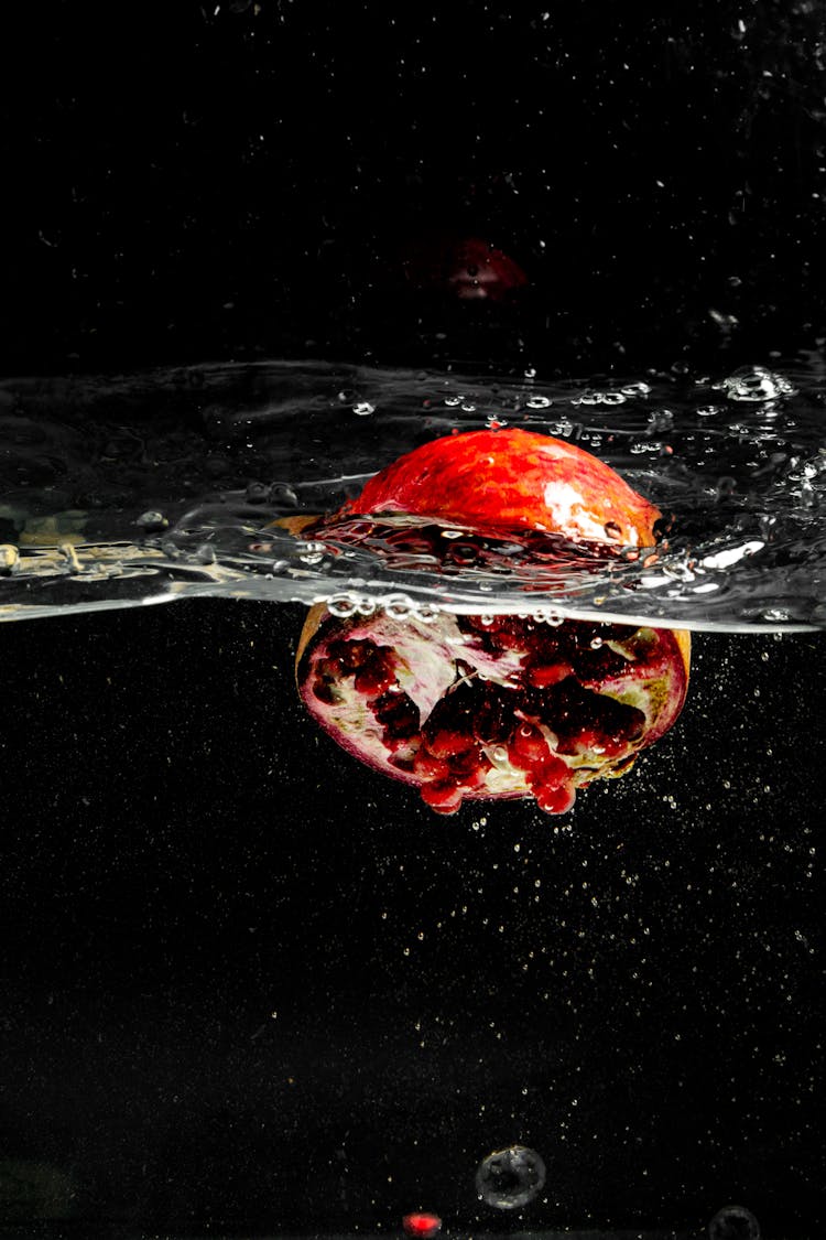 Pomegranate Fruit In Clear Water