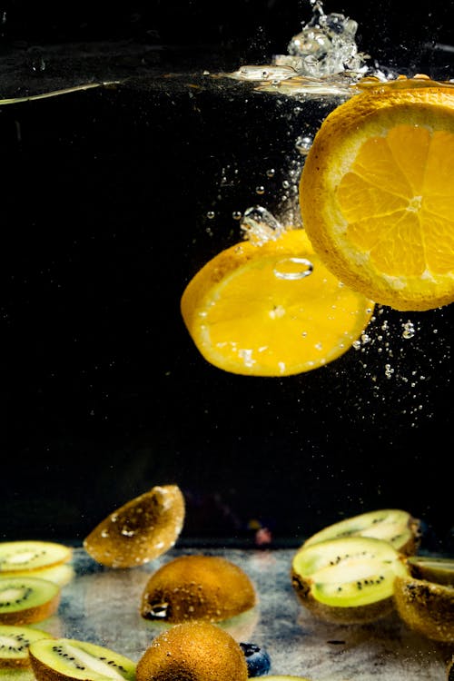 
Sliced Kiwis and Lemons Underwater