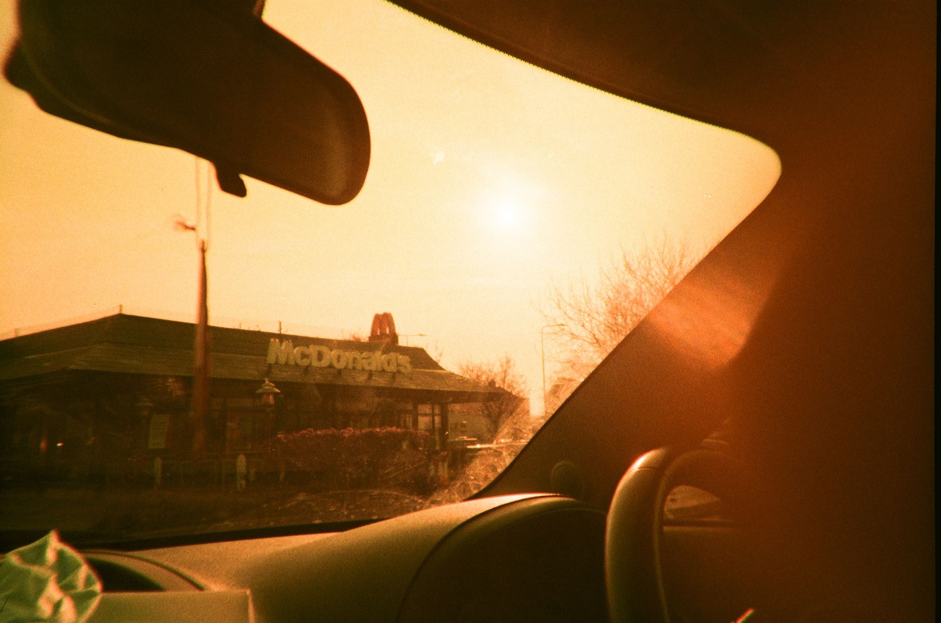 A View of a Mcdonalds from inside a Car