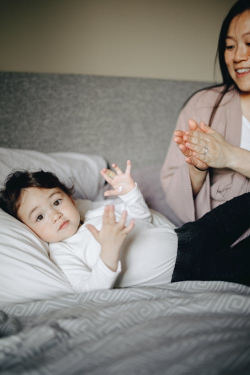 Free Mother And Child Playing Before Bedtime Stock Photo