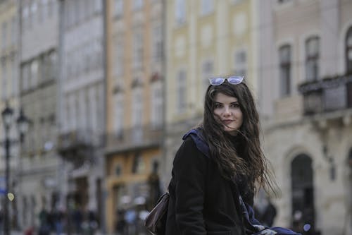 

A Pretty Woman with Sunglasses on Her Head