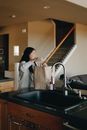 A Mother Bringing A Paper Bag Of Groceries