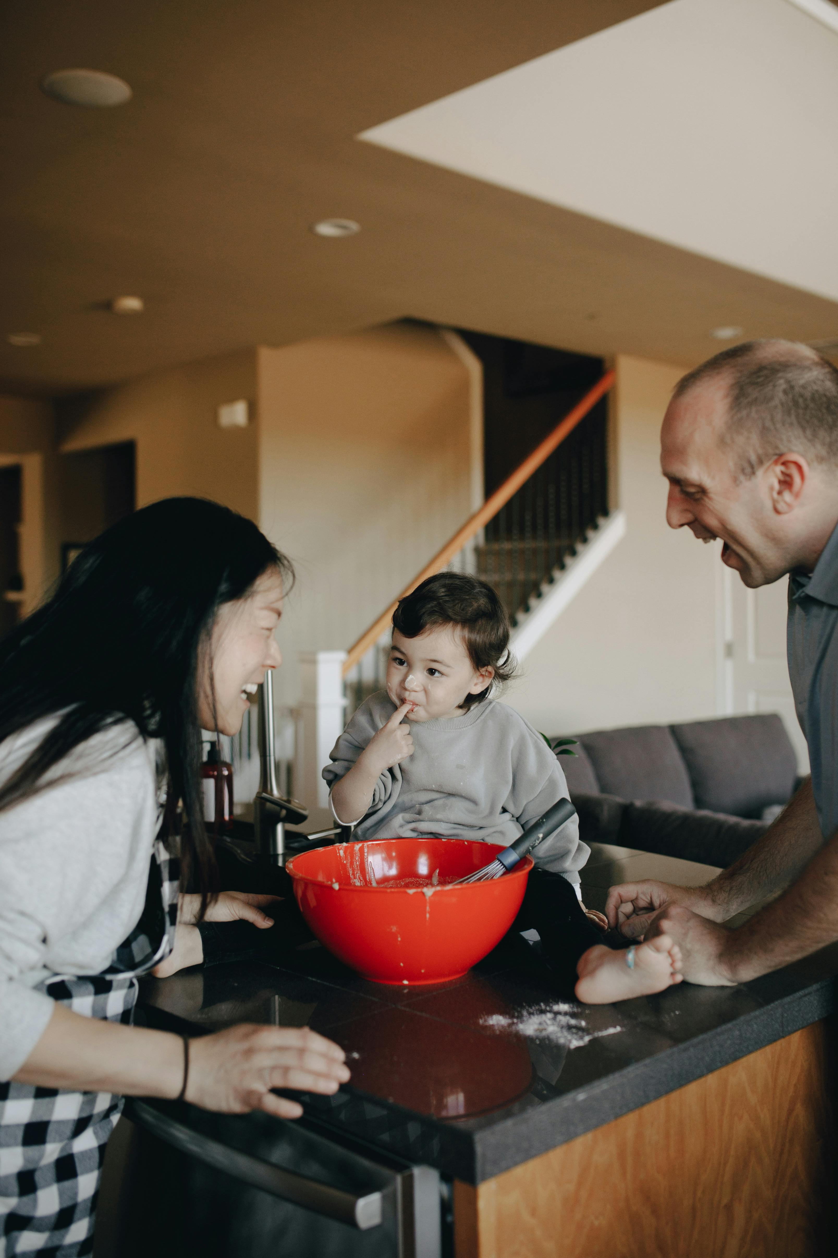 couple baking with their child