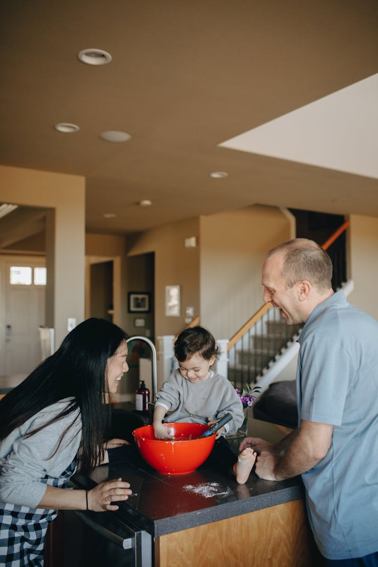 Couple Baking With Their Child