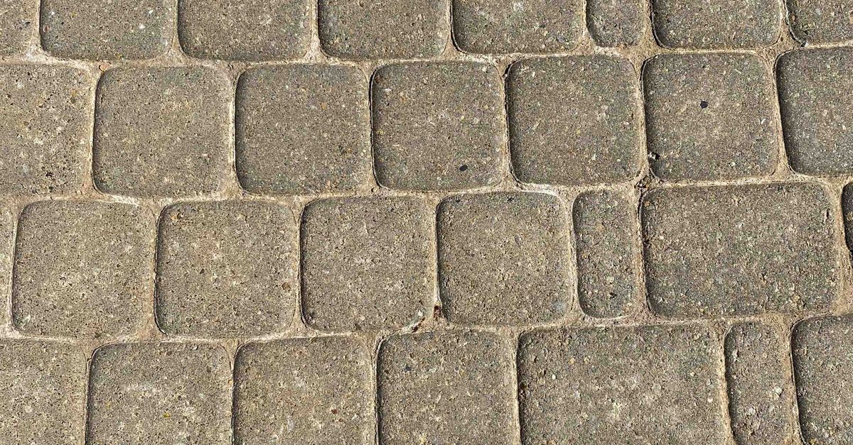 Textured road on city street in daytime · Free Stock Photo